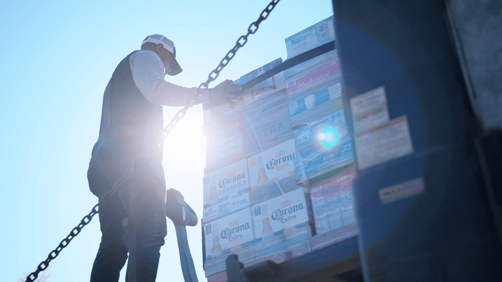 photo of man moving boxes